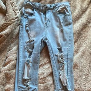 Light blue jeans with rips  from SHEIN, slightly worn size medium